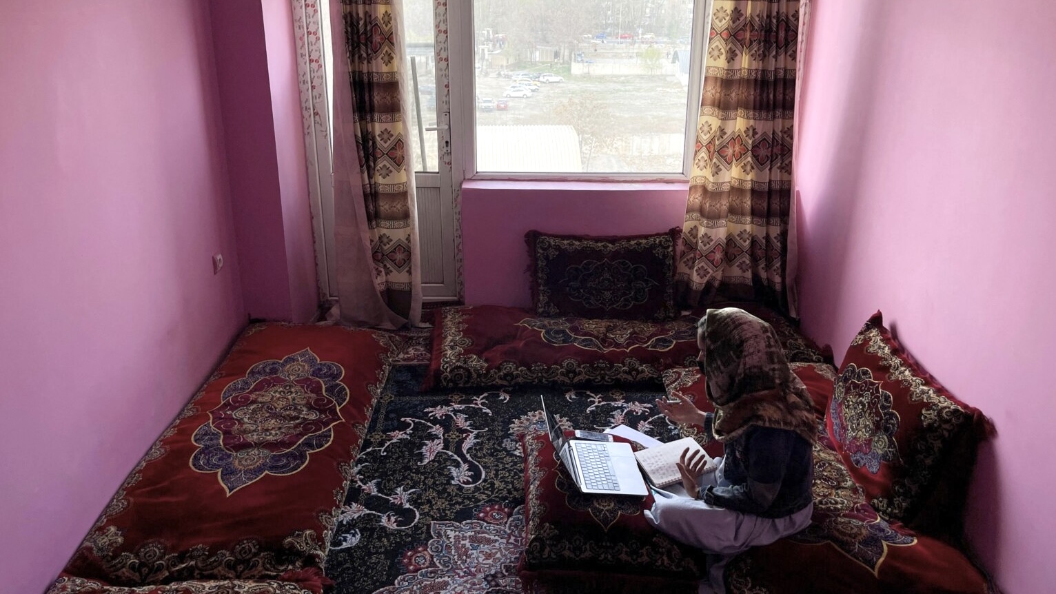 An Afghan student takes an online class at her house in Kabul, Afghanistan. (File/Reuters)