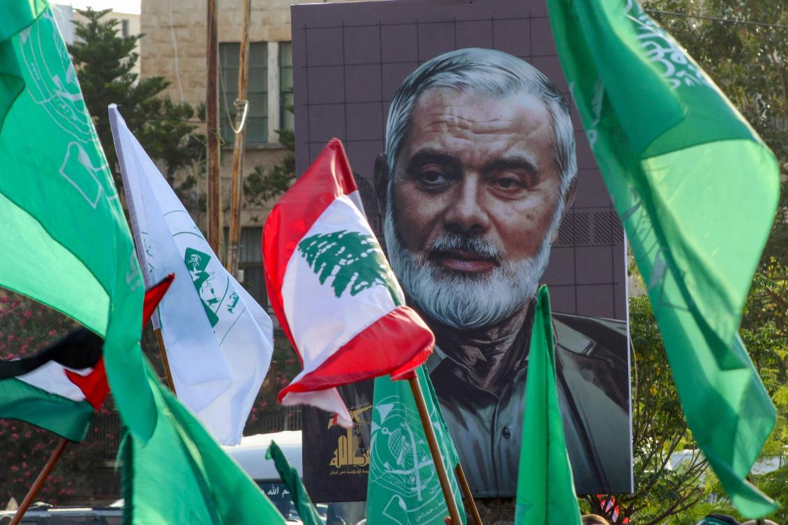 A portrait of slain Hamas leader Ismail Haniyeh is displayed during a a demonstration denouncing his killing and that Hezbollah's senior commander, in the Lebanese coastal city of Sidon. (File/AFP)