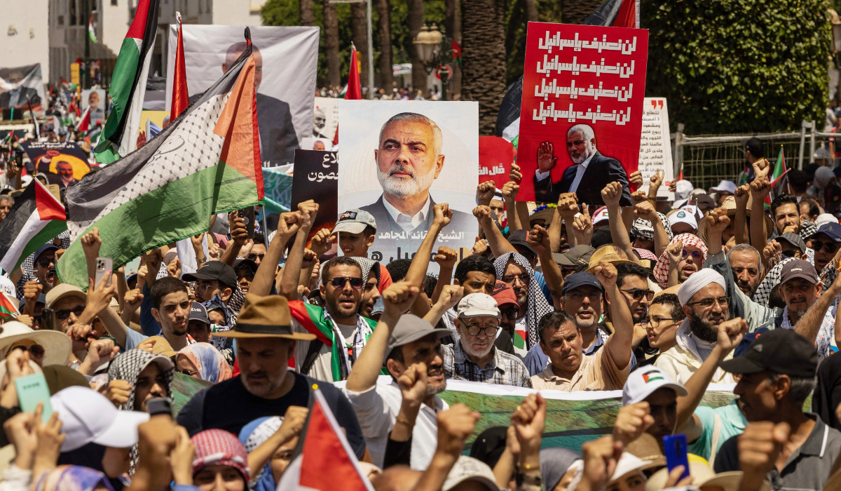 Moroccan demonstrators take part in a rally in Rabat on Saturday, protesting Israel’s killing of Hamas leader Ismail Haniyeh in Iran. (AFP)