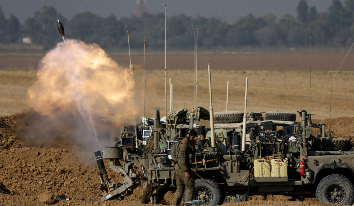 An Israeli soldier fires a mortar, amid the Israel-Hamas conflict, near the Israel-Gaza border, in Israel, July 9, 2024. (REUTERS)