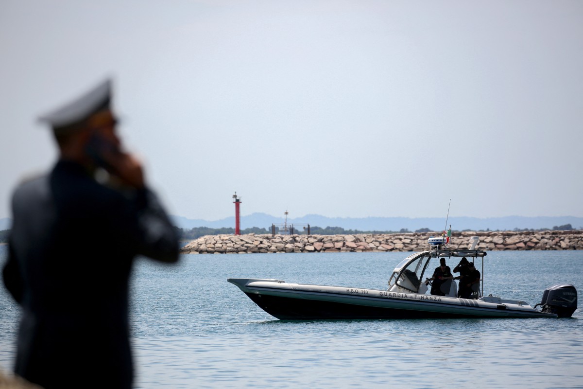 A speed boat of Italian law enforcement agency Guardia di Finanza (GdF) is navigated near the site of a recently build Italian-run migrant centre at the port of Shengjin, some 60 kms northwest of Tirana, on June 5, 2024. (AFP)