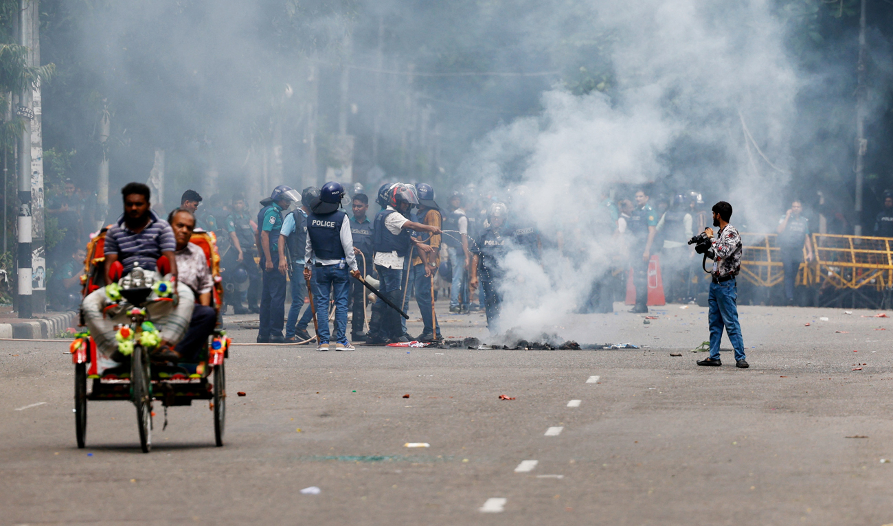 Smoke rises from a fire that was set on the street during a protest by students demanding the stepping down of Bangladeshi Prime Minister Sheikh Hasina, following quota reform protests, in Dhaka, Bangladesh, August 4, 2024. (REUTERS)
