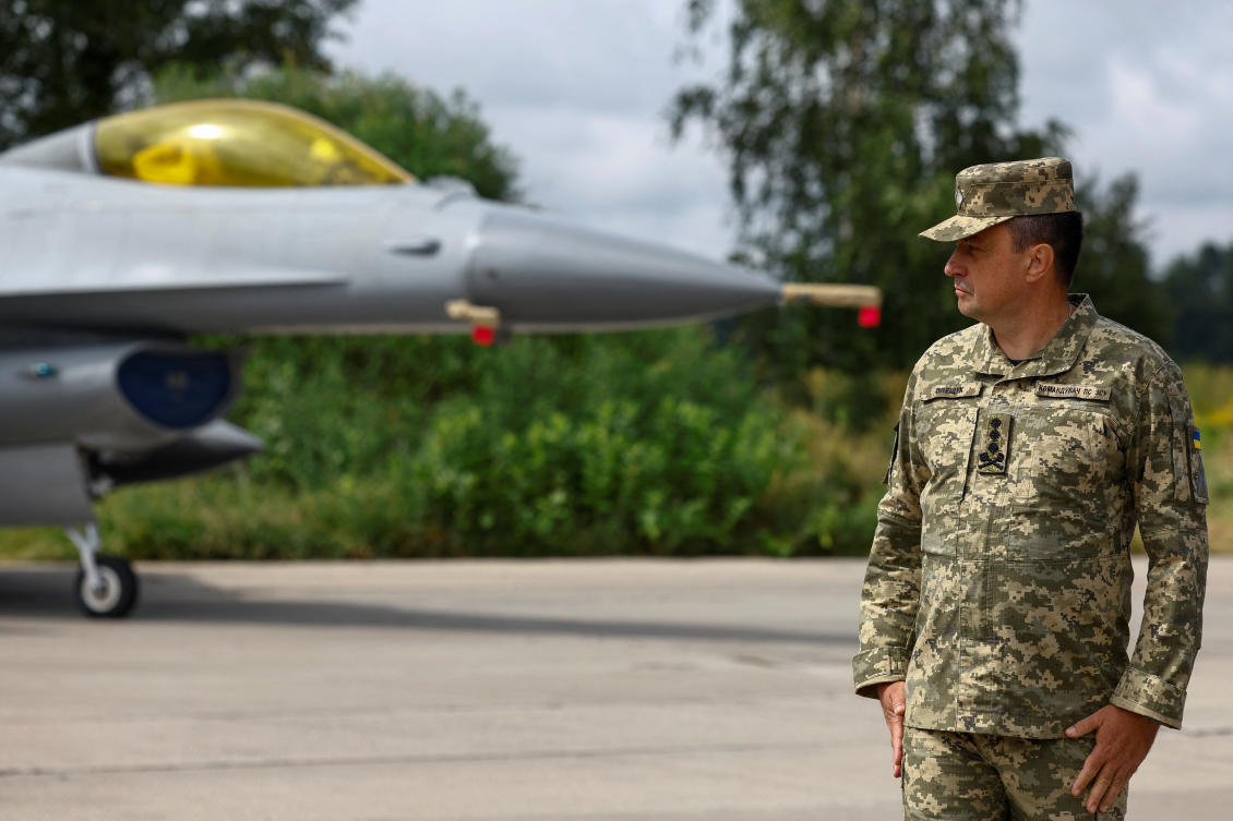 Commander of the Ukrainian Air Forces Lt. Gen. Mykola Oleschuk stands next to an F-16 fighting aircraft, amid Russia’s attack on Ukraine, in an undisclosed location, Ukraine August 4, 2024. (Ukraine)