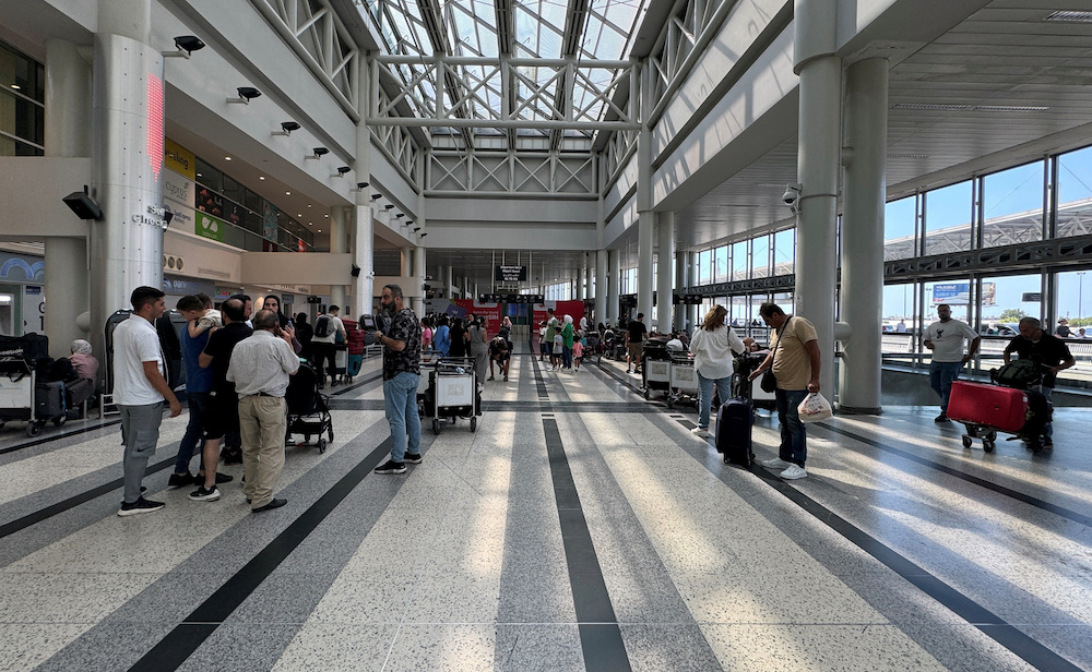 Turkiye urged its citizens in Lebanon to leave the country if they do not need to stay, due to the possibility that the security situation there will deteriorate rapidly. Above, travelers at the Beirut-Rafic Al Hariri International Airport on Aug. 4, 2024. (Reuters)