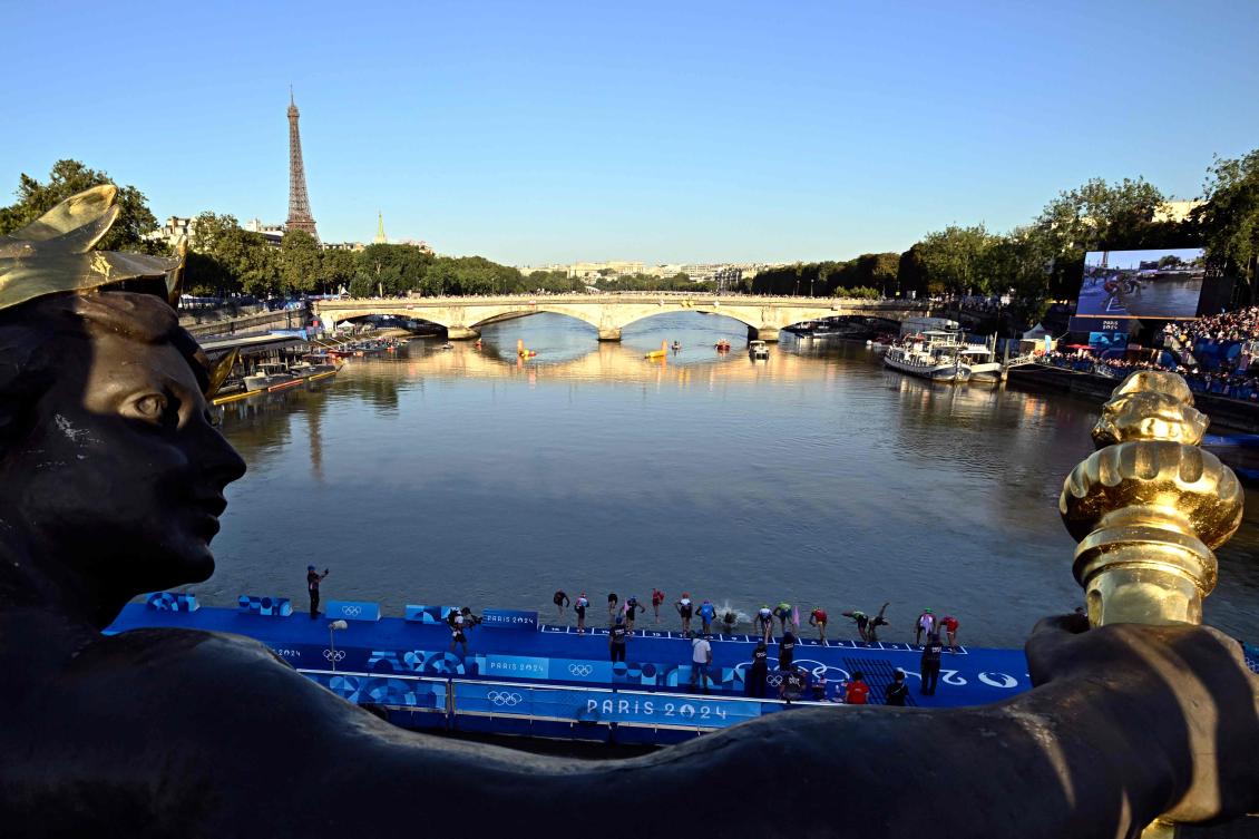 Organizers said tests showed water quality at the triathlon site would be within the limits mandated by World Triathlon. (AFP)