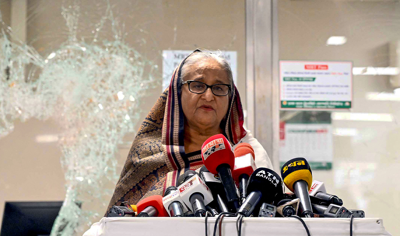 In this handout photograph taken and released on July 25, 2024 by Bangladesh Prime Minister's Office, Prime Minister Sheikh Hasina addresses the media at a vandalized metro station in Mirpur, after the anti-quota protests. (AFP/PM's Office)