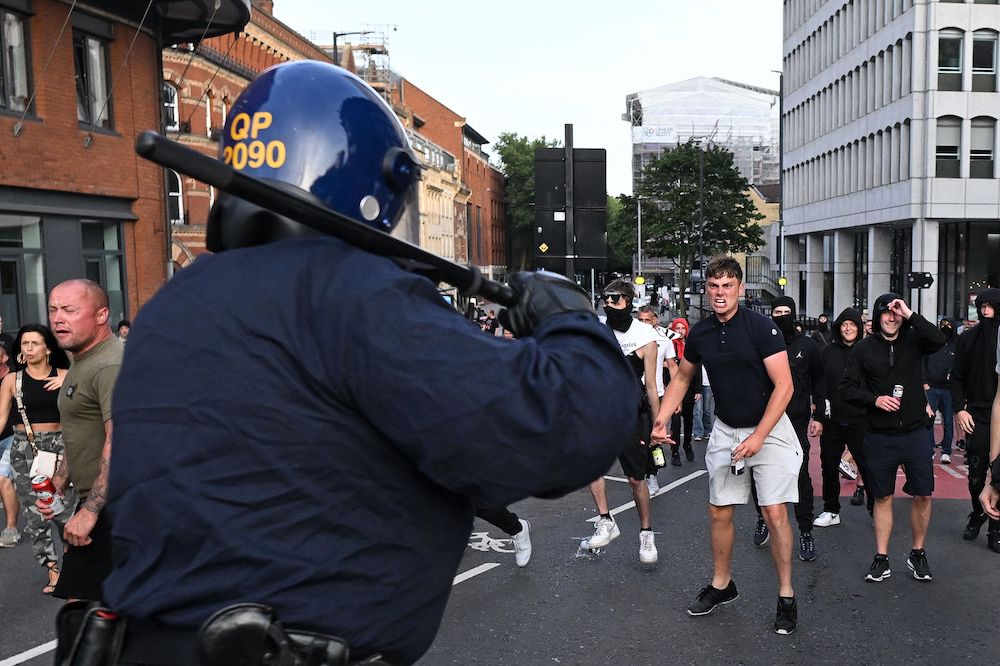 Above, riot police face protestors in Bristol, southern England on Aug. 3, 2024. (AFP)