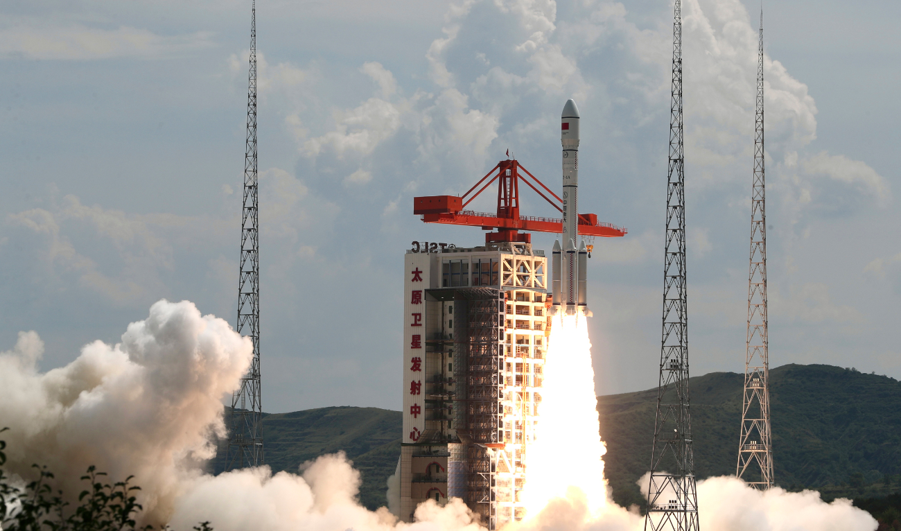 A modified Long March-6 carrier rocket carrying a new satellite group blasts off from the Taiyuan Satellite Launch Center in north China’s Shanxi Province on Tuesday. (AFP)