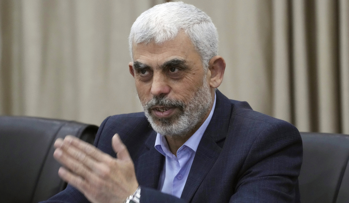 Yehia Sinwar, head of Hamas in Gaza, greets his supporters during a meeting with leaders of Palestinian factions at his office in Gaza City, Wednesday, April 13, 2022. (AP)