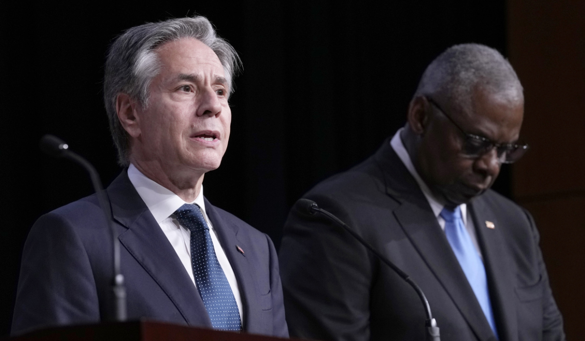 Secretary of State Antony Blinken, left, standing with Defense Secretary Lloyd Austin, right, speaks during a news conference at the Unites States Naval Academy in Annapolis, Md., Tuesday, Aug. 6, 2024. (AP)