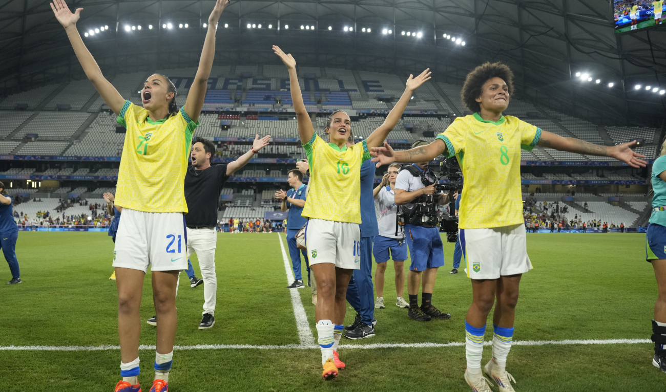 Brazil's Lauren, left, Gabi Nunes, center, and Yaya Vitoria celebrate their team's 4-2 victory over Spain at the end of a women's semifinal football match at the 2024 Summer Olympics Tuesday at Marseille Stadium in Marseille. (AP)