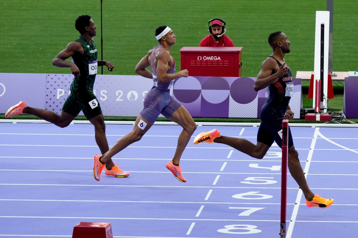 Matthew Hudson-Smith, of Britain, right, crosses the finish line in his men's 400-meters semifinal at the 2024 Summer Olympics Tuesday in Saint-Denis, France. (AP)