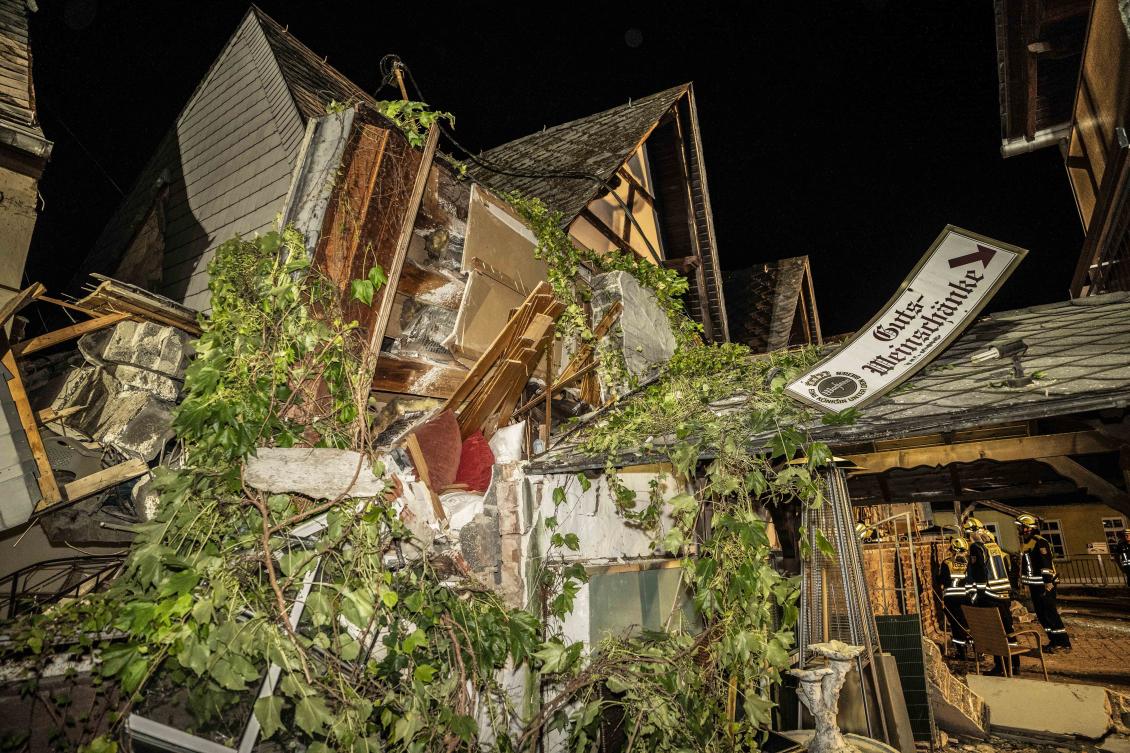 Above, debris are seen after the collapse of a hotel in Kroev, Germany on Aug. 7, 2024. (Foto Hosser/dpa via AP)