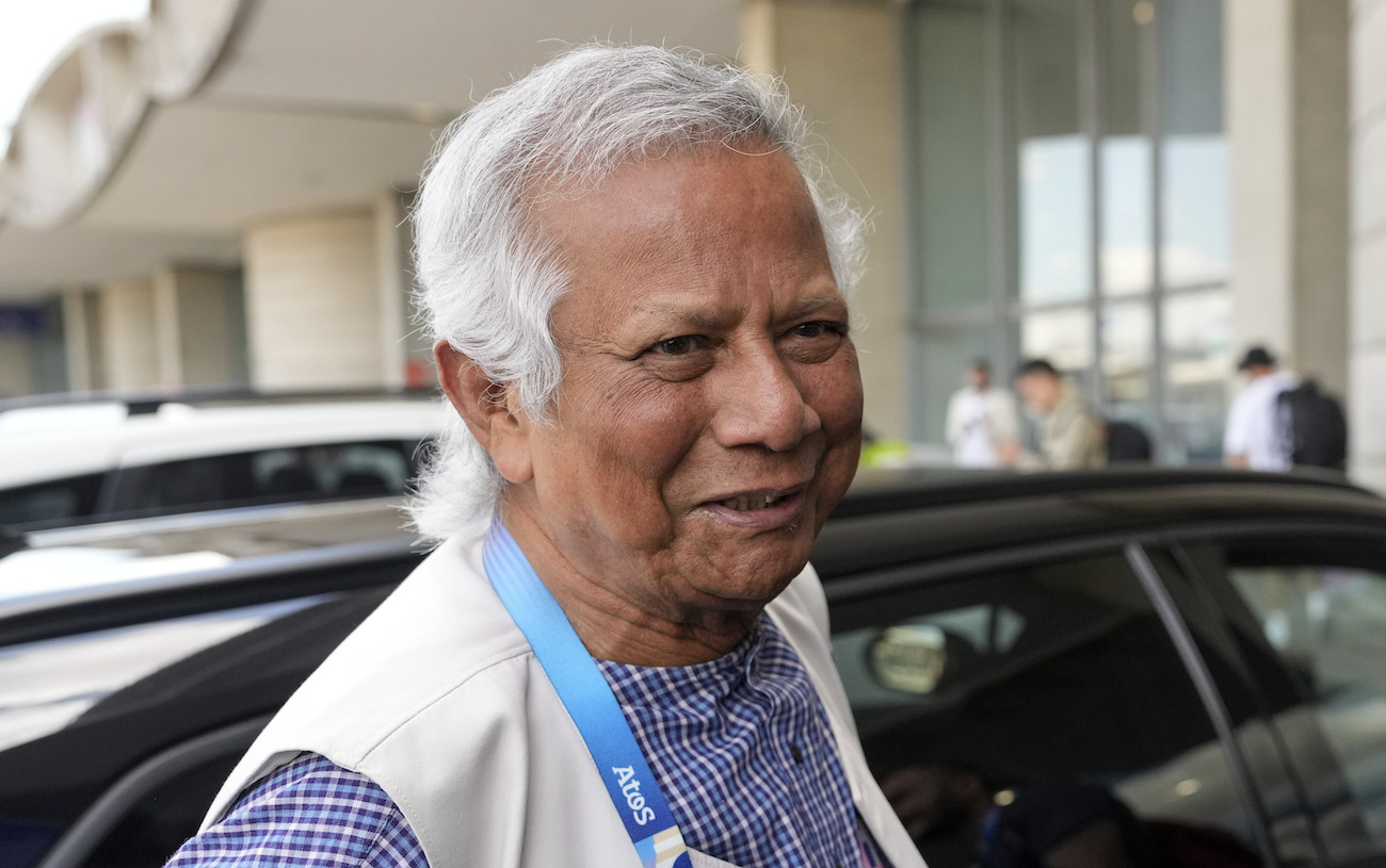 Nobel laureate Muhammad Yunus smiles upon his arrival at Charles de Gaulle’s airport in Roissy, north of Paris, Wednesday, Aug. 7, 2024. (AP)