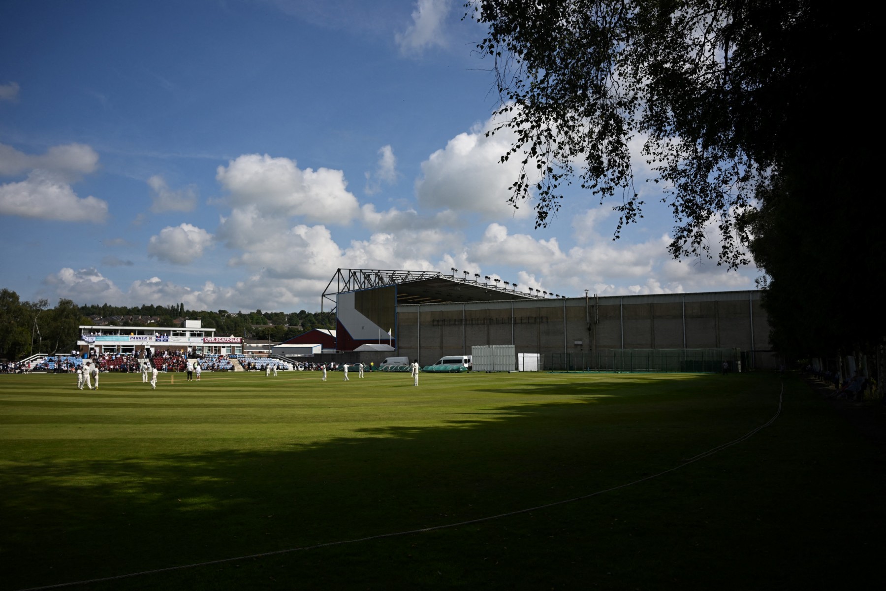 File photo of People play cricket outside Turf Moor in Burnley, north-west England (AFP)