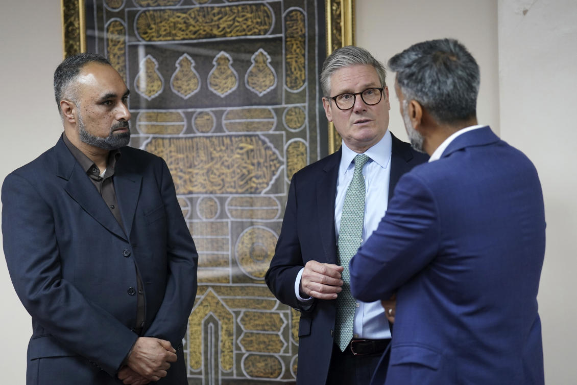 British PM Sir Keir Starmer speaks with members of the mosque management team at The Hub - Solihull Mosque, in Solihull, West Midlands, England, Thursday Aug. 8, 2024. (AP)