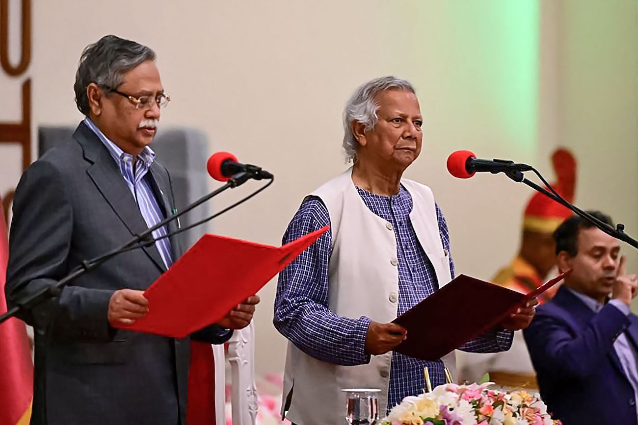 Nobel laureate Muhammad Yunus (C) takes the oath of office as the chief adviser of Bangladesh’s new interim government in Dhaka on August 8, 2024. (AFP)