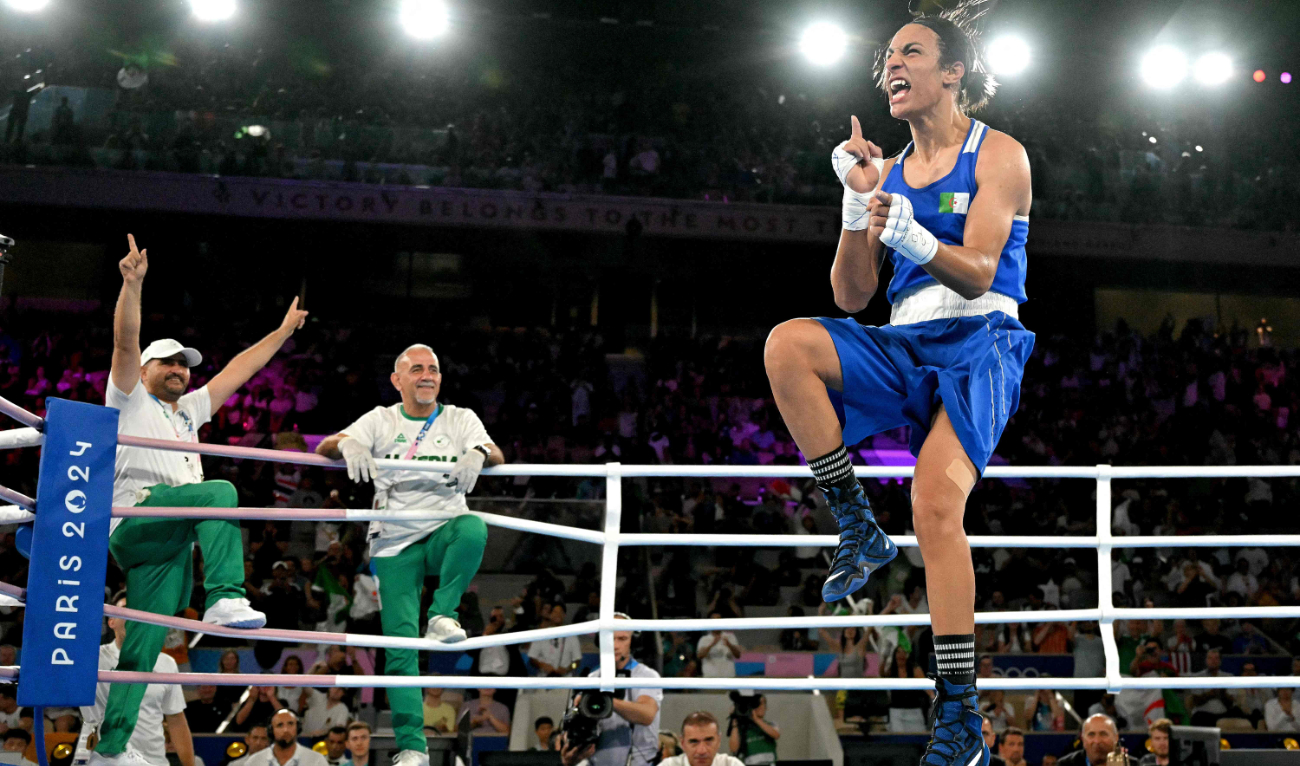 Algeria's Imane Khelif reacts after beating Thailand's Janjaem Suwannapheng in the women's 66kg semifinal boxing match during the Paris 2024 Olympic Games at the Roland Garros Stadium on Tuesday. (AFP)