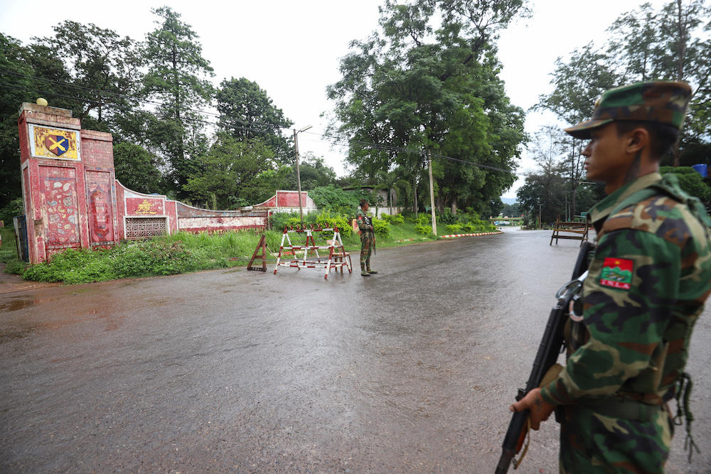 Above, members of the ethnic armed group Ta’ang National Liberation Army stand guard at a checkpoint in the town of Kyaukme in Myanmar’s northern Shan State. (AFP)