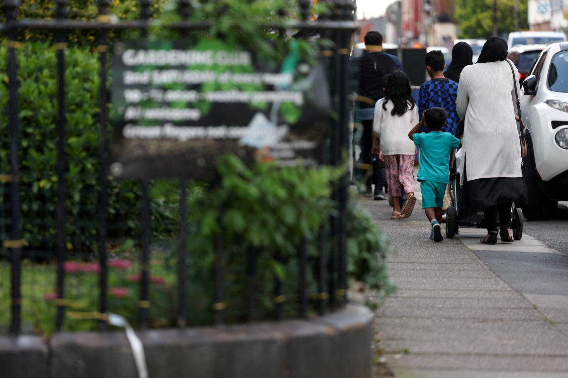 A Muslim family walks in a street, amid rioting across the country in which mosques and Muslims have been targets, in Liverpool on Aug. 6, 2024. (Reuters)