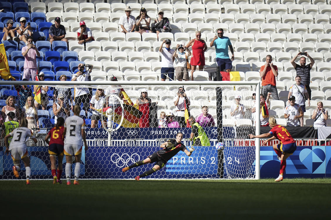 Germany’s goalkeeper Ann-Katrin Berger stops a penalty by Spain’s Alexia Putellas, right, during the women’s bronze medal soccer match at the Lyon stadium, during the 2024 Summer Olympics, on Aug. 9, 2024, in Decines, France. (AP)