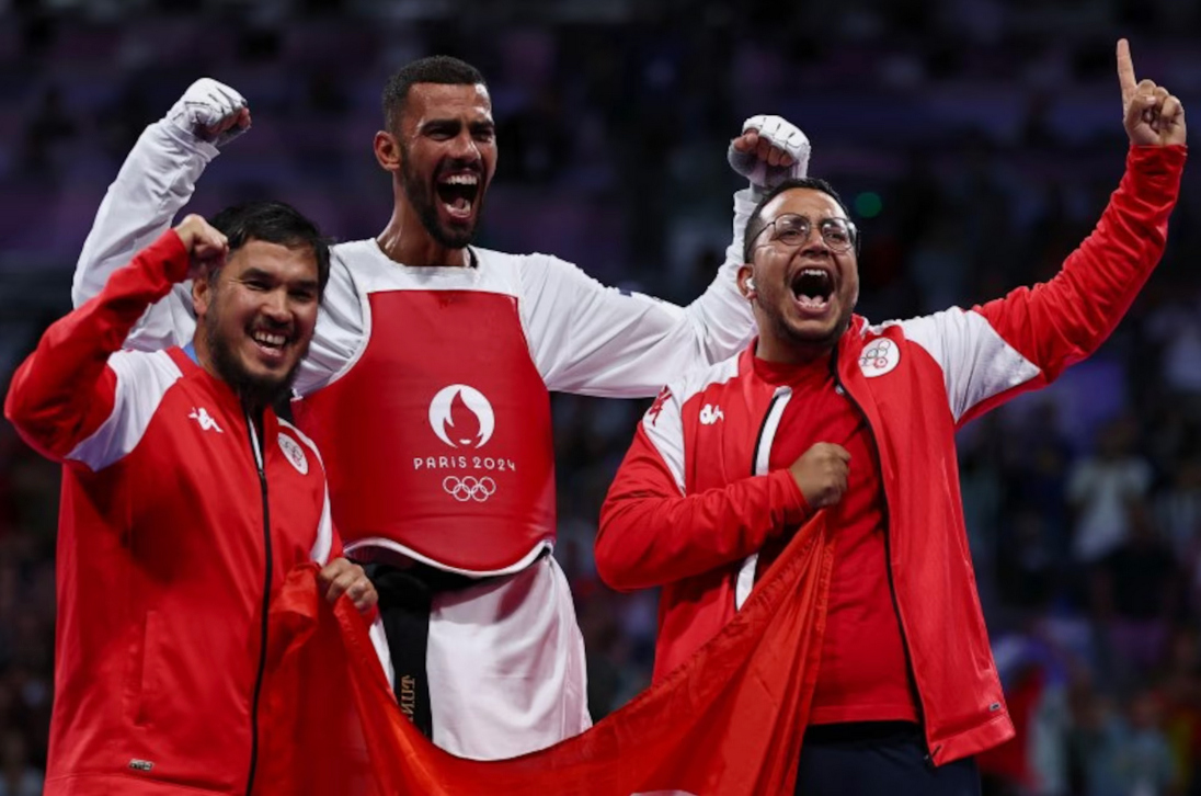 Firas Katoussi of Tunisia celebrates winning his bout against Mehran Barkhordari of Iran. (Reuters)