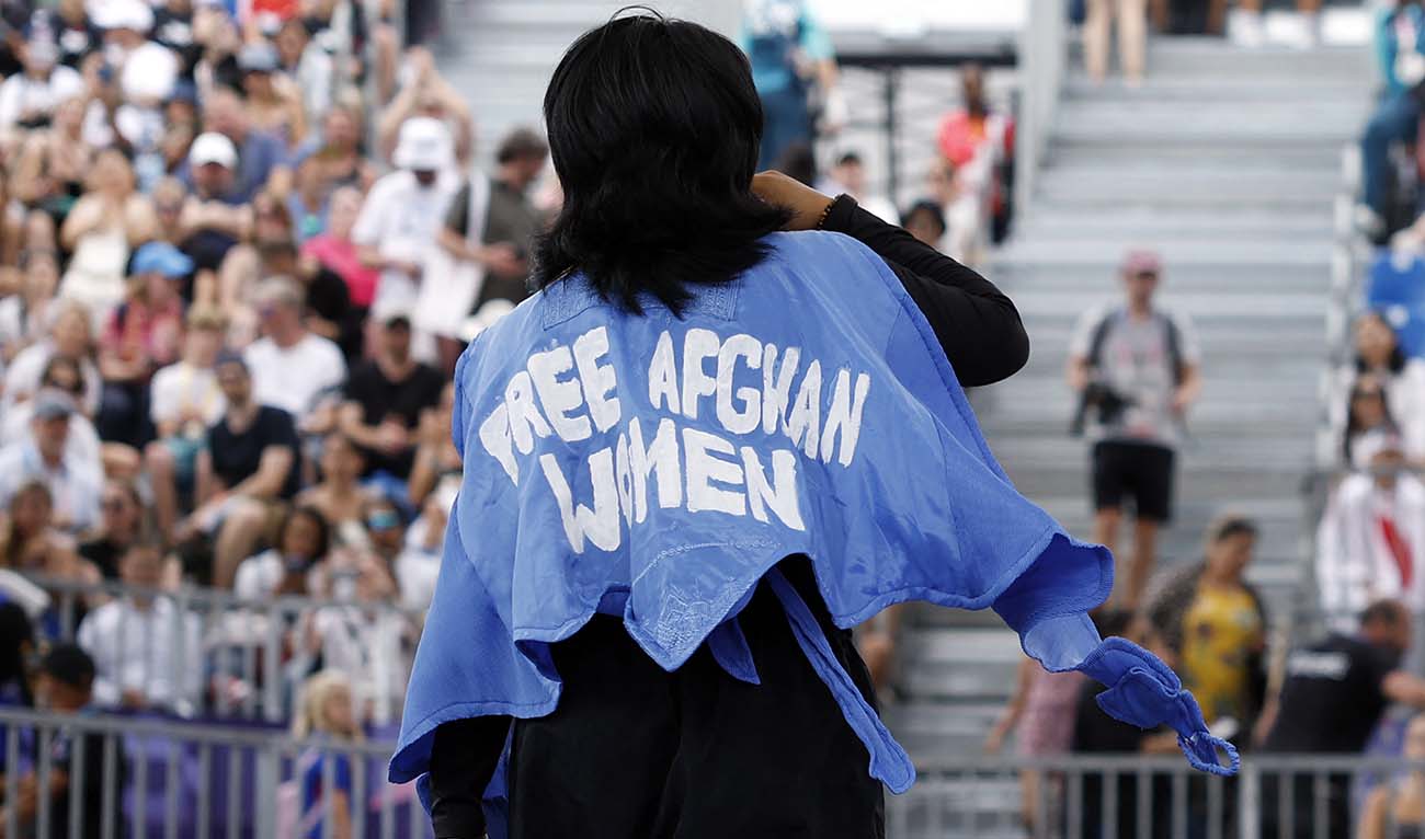 Refugee Olympic team's Manizha Talash, known as Manizha wears a jacket reading "Free Afghan women" as she competes in the Women's Breaking dance qualifying round of the Paris 2024 Olympic Games at La Concorde in Paris, on August 9, 2024. (AFP)