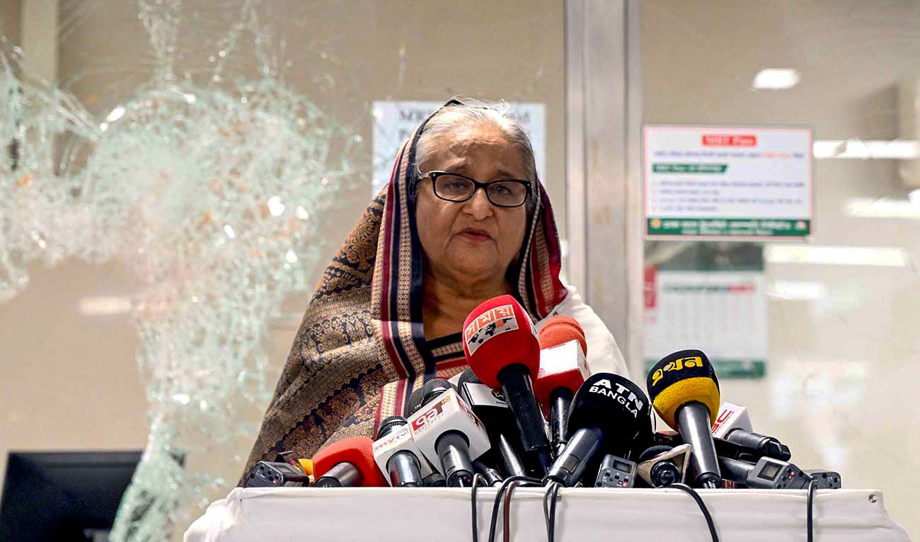 In this handout photograph taken and released on July 25, 2024 by Bangladesh Prime Minister's Office, Prime Minister Sheikh Hasina addresses the media at a vandalized metro station in Mirpur, after the anti-quota protests. (AFP)