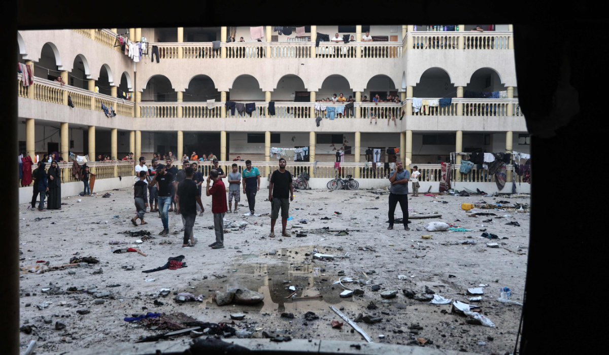Displaced Palestinians gather in the yard of a school hit by an Israeli strike in Gaza City on August 10, 2024, that killed around 100 people. (AFP)