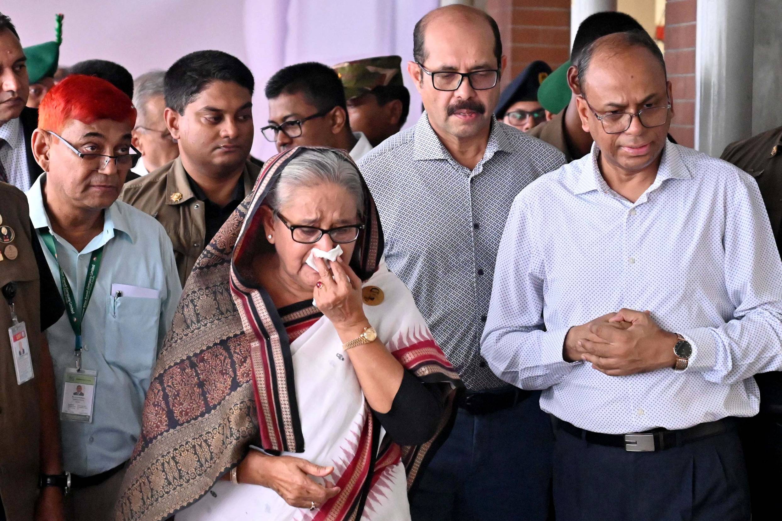 Former Prime Minister Sheikh Hasina weeps while she visits a metro station in Mirpur vandalized by students during the anti-quota protests in July. (File/Bangladesh Prime Minister's Office))