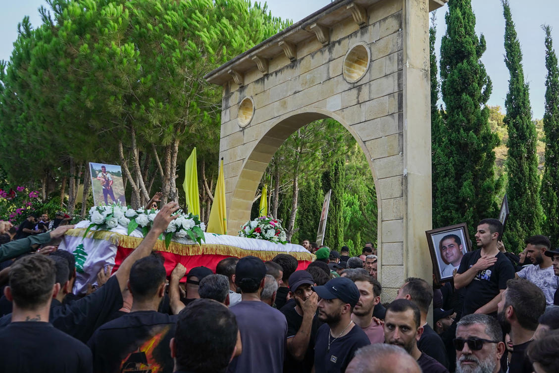 Mourners carry the coffin of a civilian killed a day earlier along with a Hezbollah fighter in a reported Israeli strike on the town of Jouaiya in the Tyre district of southern Lebanon, during his funeral on August 8, 2024. (File/AFP)