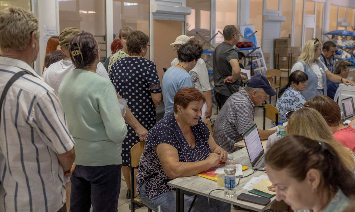 Residents who evacuated due to shelling from villages that are close to the border with Russia gather in an evacuation center in Sumy, on August 11, 2024, amid the Russian invasion of Ukraine. (AFP)