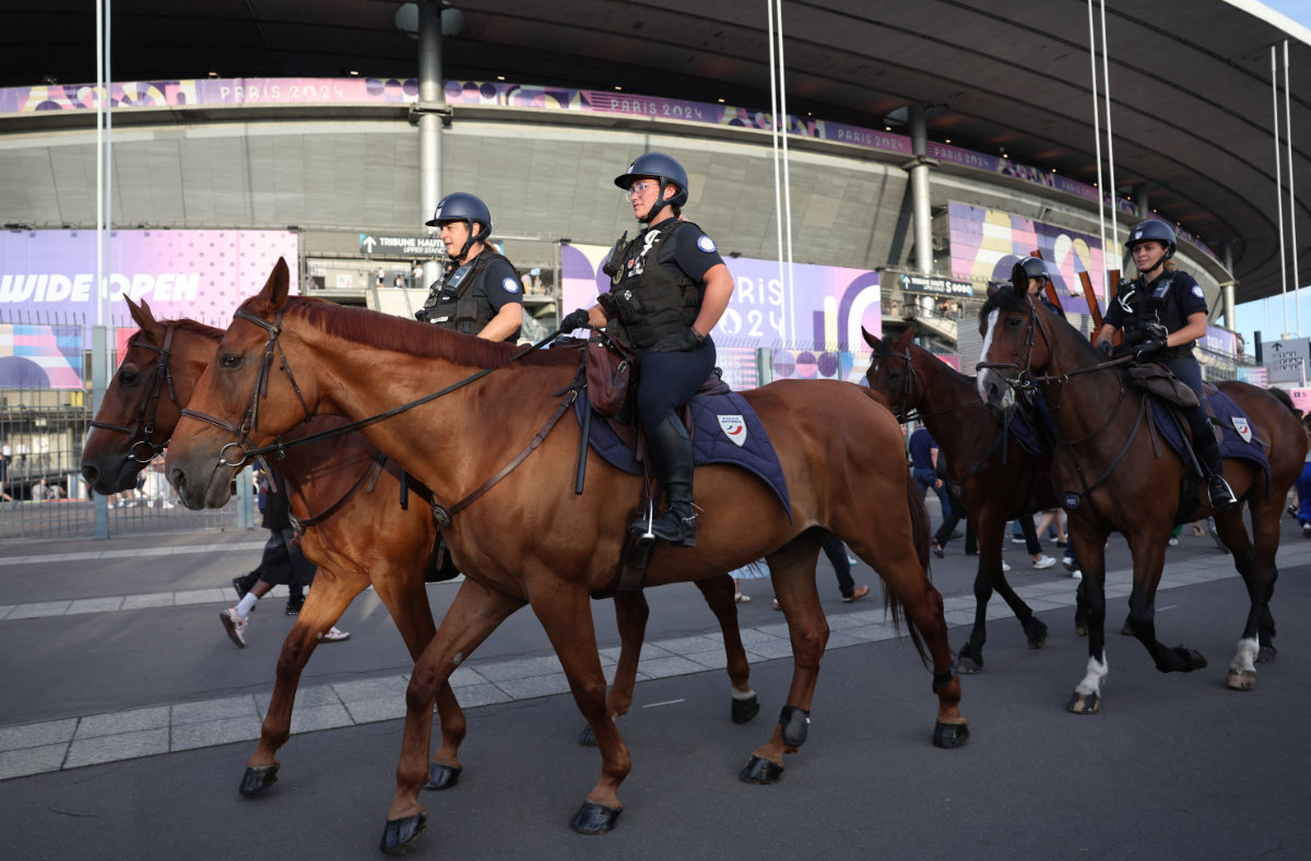 General view of police officers on horses outside the Stade de France in Saint-Denis, France, before the closing ceremony of the Paris 2024 Olympics on August 11, 2024. (REUTERS)
