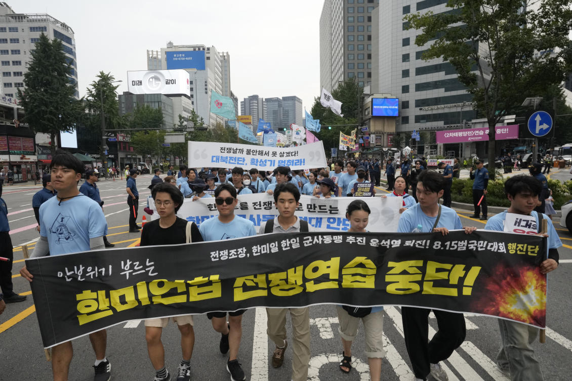 South Korean protesters march during a rally opposing the joint military exercises between the US and South Korea in Seoul, South Korea. The banner reads "Stop the military exercises between the U.S. and South Korea."(AP)