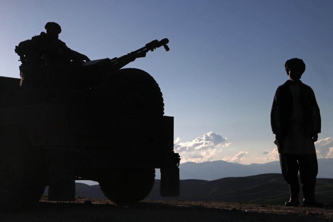 Taliban security personnel stand guard near a poppy field in Argo district on May 12, 2024. (File/AFP)