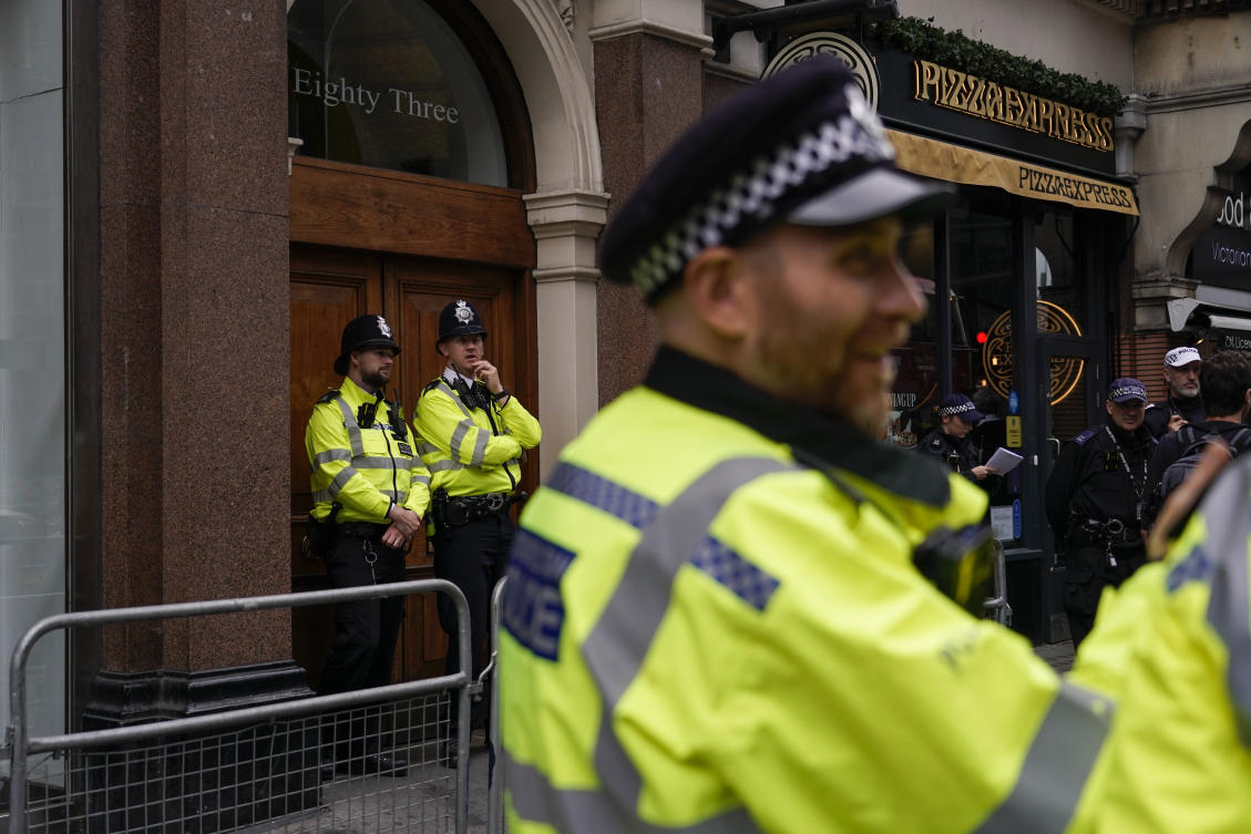 Police officers patrol outside the London offices of the political party Reform UK, ahead of an anti-far right protest, in London, Saturday, Aug. 10, 2024. (AP)