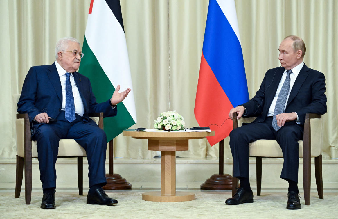 Russian President Vladimir Putin, right, meets with Palestinian President Mahmoud Abbas outside Moscow on Aug. 13, 2024. (Sputnik via Reuters)