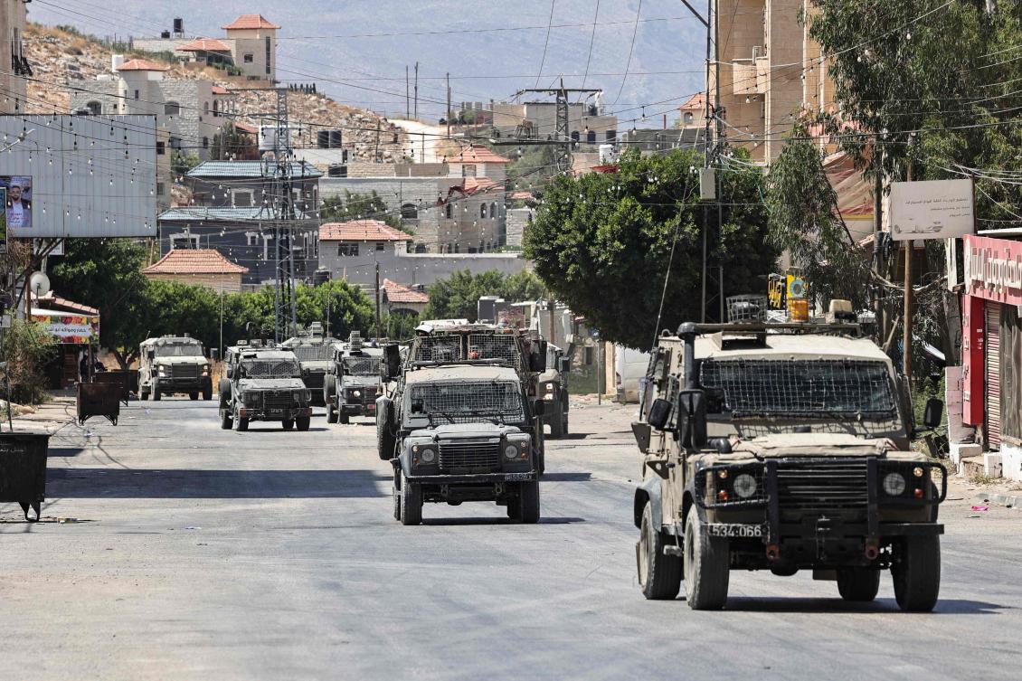 Israel announced in June it was going to legalize five outposts in the West Bank, establish three new settlements, among other actions. Above, Israeli armored vehicles drive on a road during a raid in Tubas city in the occupied West Bank on Aug. 14, 2024. (AFP)