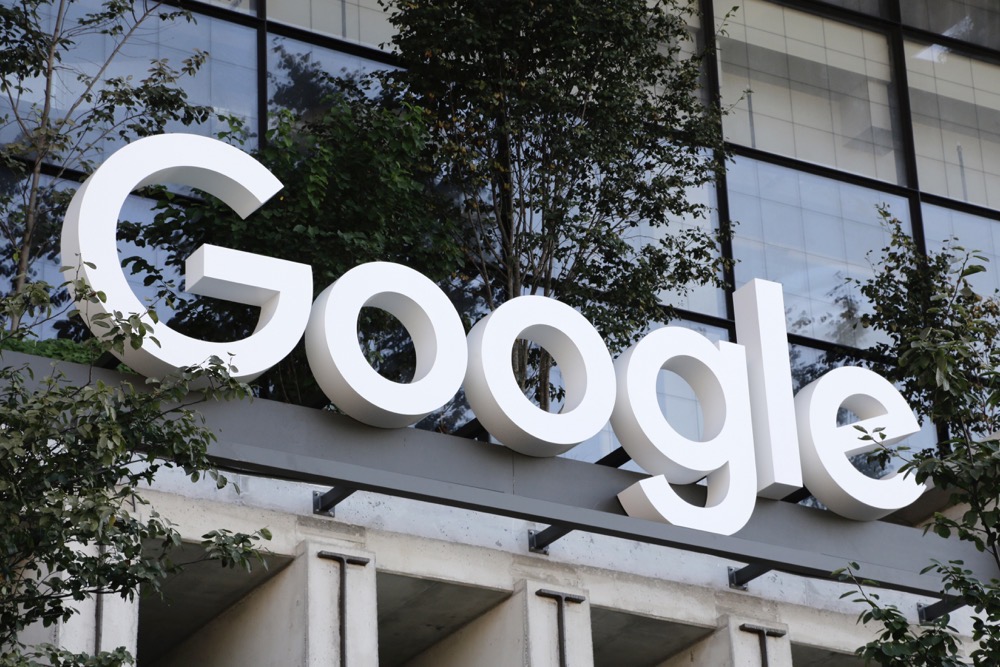 Google sign hangs over an entrance to the company's new building. (AP)