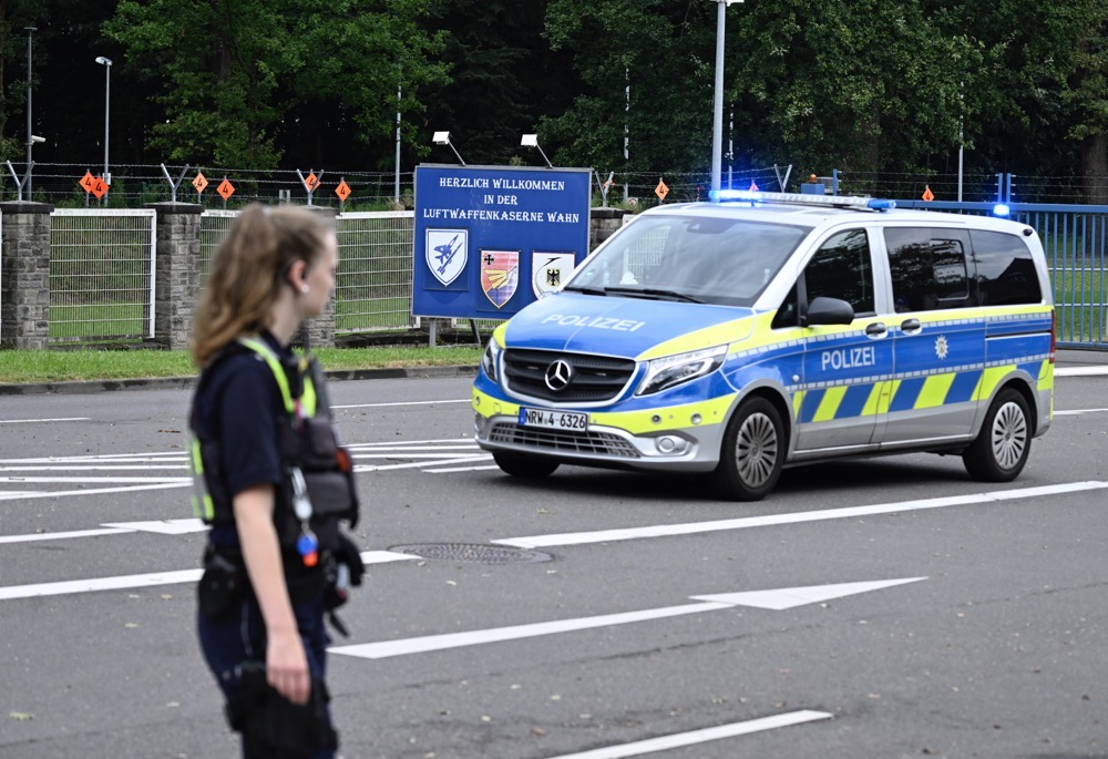 A police car stands in front of the entrance to the air force barracks in Wahn outside Cologne, Germany. (AP)