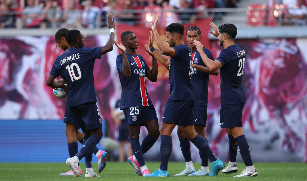Paris Saint-Germain's Portuguese forward #09 Goncalo Ramos (3rdR) celebrates with team mates after scoring the 1-1 equalizing goal during the pre-season friendly football club match between Germany's RB Leipzig and France's Paris Saint-Germain in Leipzig, eastern Germany on August 10, 2024. (AFP)