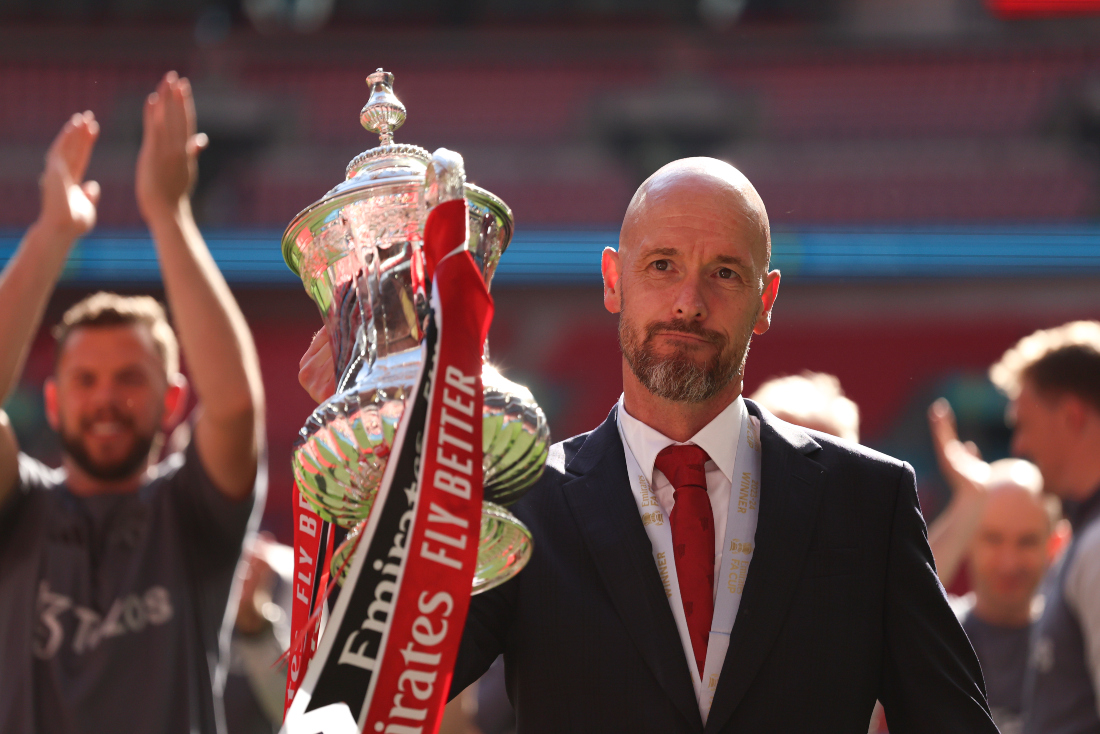 Manchester United's head coach Erik ten Hag with the trophy after winning the English FA Cup final against Manchester City at Wembley Stadium in London on May 25, 2024. (AP)