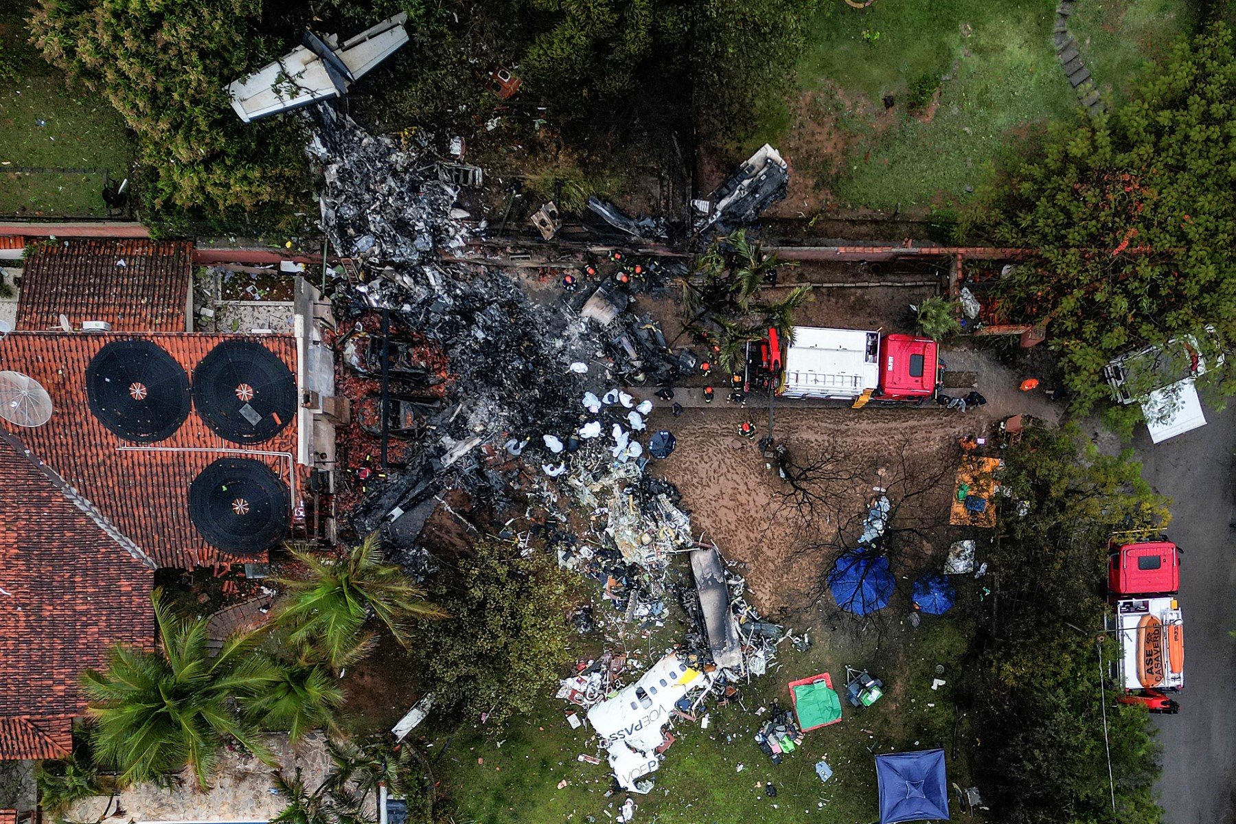 Photo shows an aerial view of the wreckage of an airplane that crashed with 61 people on board in Vinhedo, Sao Paulo State, Brazil, on August 10, 2024 (AFP)