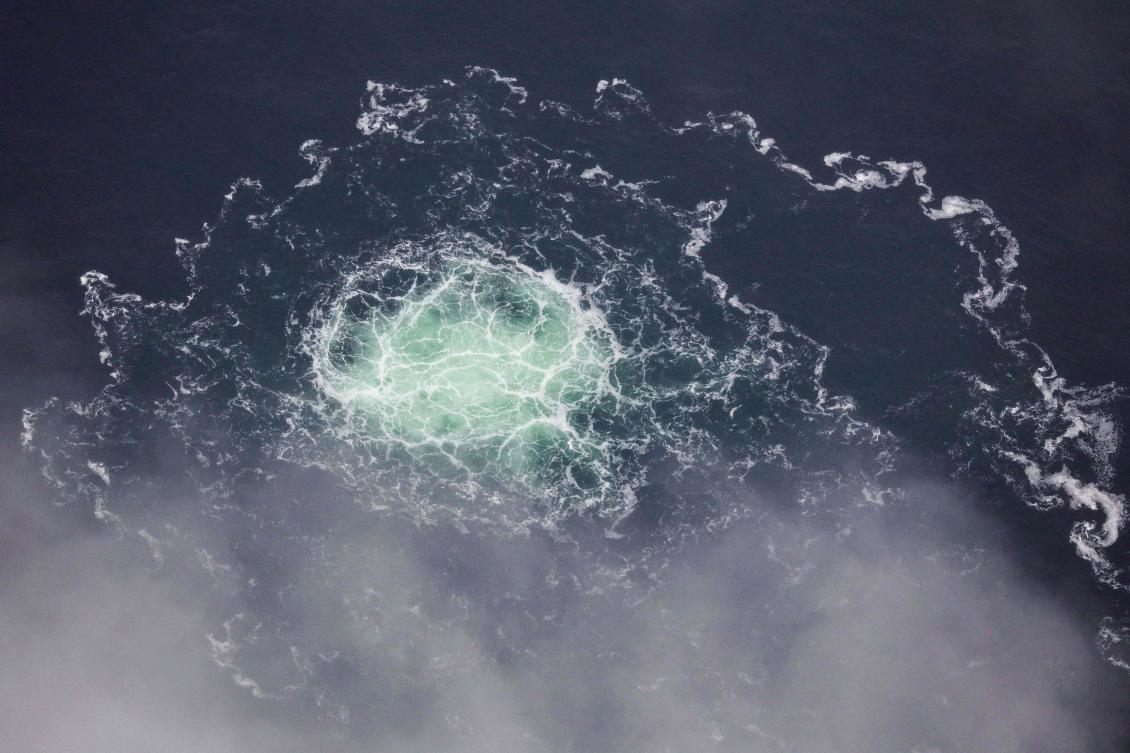 (FILES) This file handout photo taken on September 28, 2022 from an aircraft of the Swedish Coast Guard (Kustbevakningen) shows the release of gas emanating from a leak on the Nord Stream 2 gas pipeline, in the Swedish economic zone in the Baltic Sea. (AFP)
