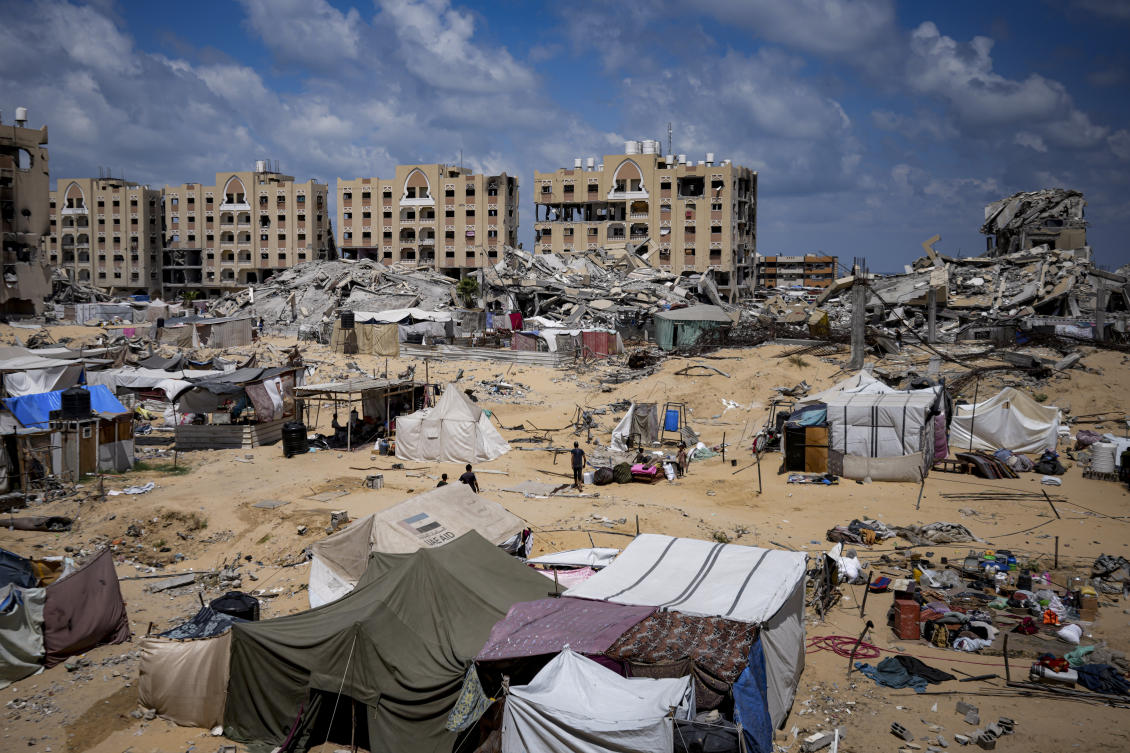 Palestinians displaced by the Israeli air and ground offensive on the Gaza Strip flee from Hamad City, following an evacuation order by the Israeli army to leave parts of the southern area of Khan Younis. (AP)