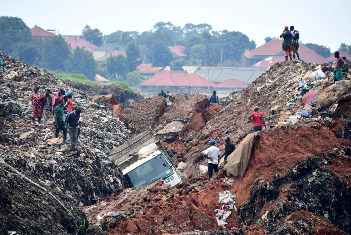 Volunteers search to retrieve bodies of residents killed by a landslide in a landfill in the northern district of Kiteezi outside Kampala on Aug. 10, 2024. (Reuters)