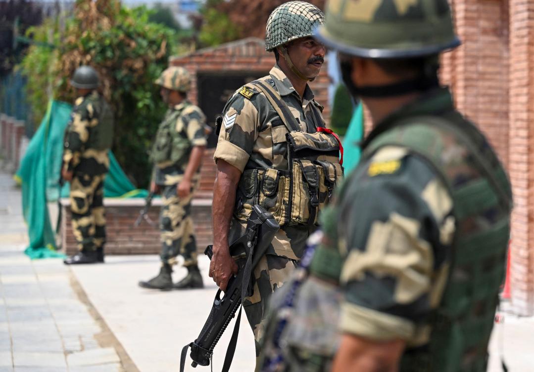 Above, Indian border security personnel stand guard along a street in Srinagar on Aug. 16, 2024. Indian-administered Jammu and Kashmir will hold elections for the assembly of the disputed region for the first time in a decade. (AFP)