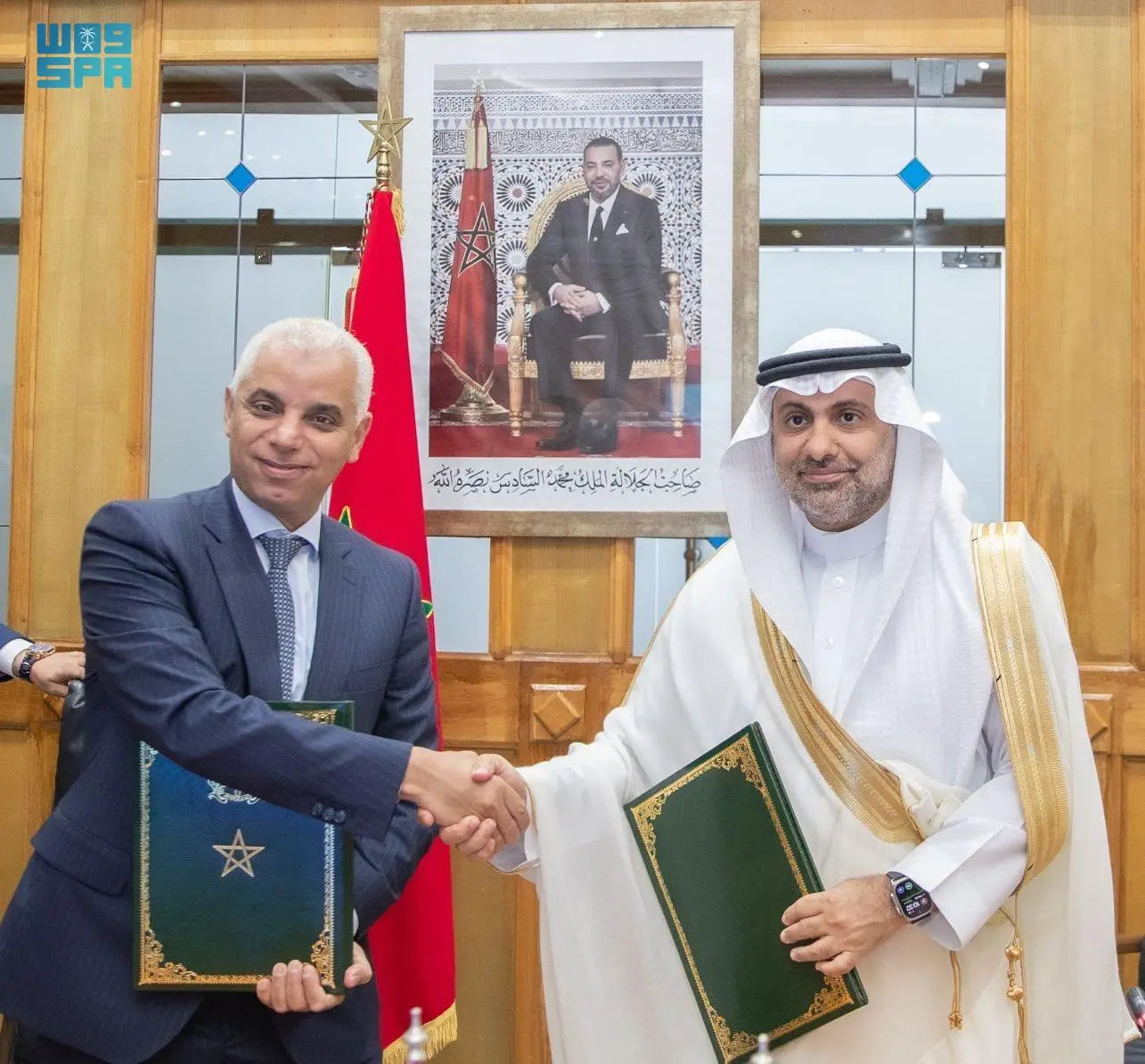 Moroccan Minister of Health and Social Protection Khalid Ait Taleb and Saudi Ambassador to Morocco Sami bin Abdullah Alsaleh seal their cooperation deal with a handshake at the Health Ministry headquarters in Rabat on Friday. (SPA photo)