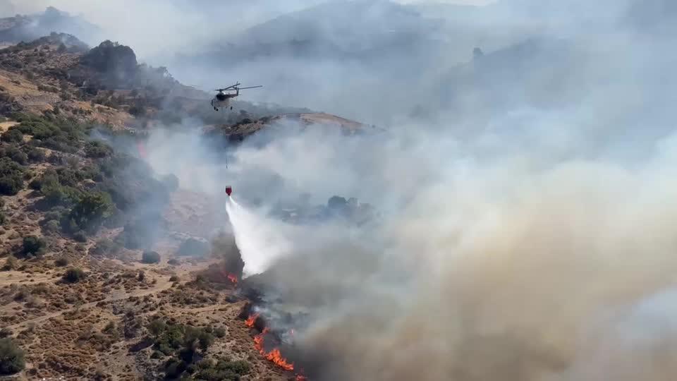 A forest fire in Turkiye’s western coastal city of Izmir inched closer to residential areas, forcing some people to be evacuated, the local governor said on Friday.(Reuters)