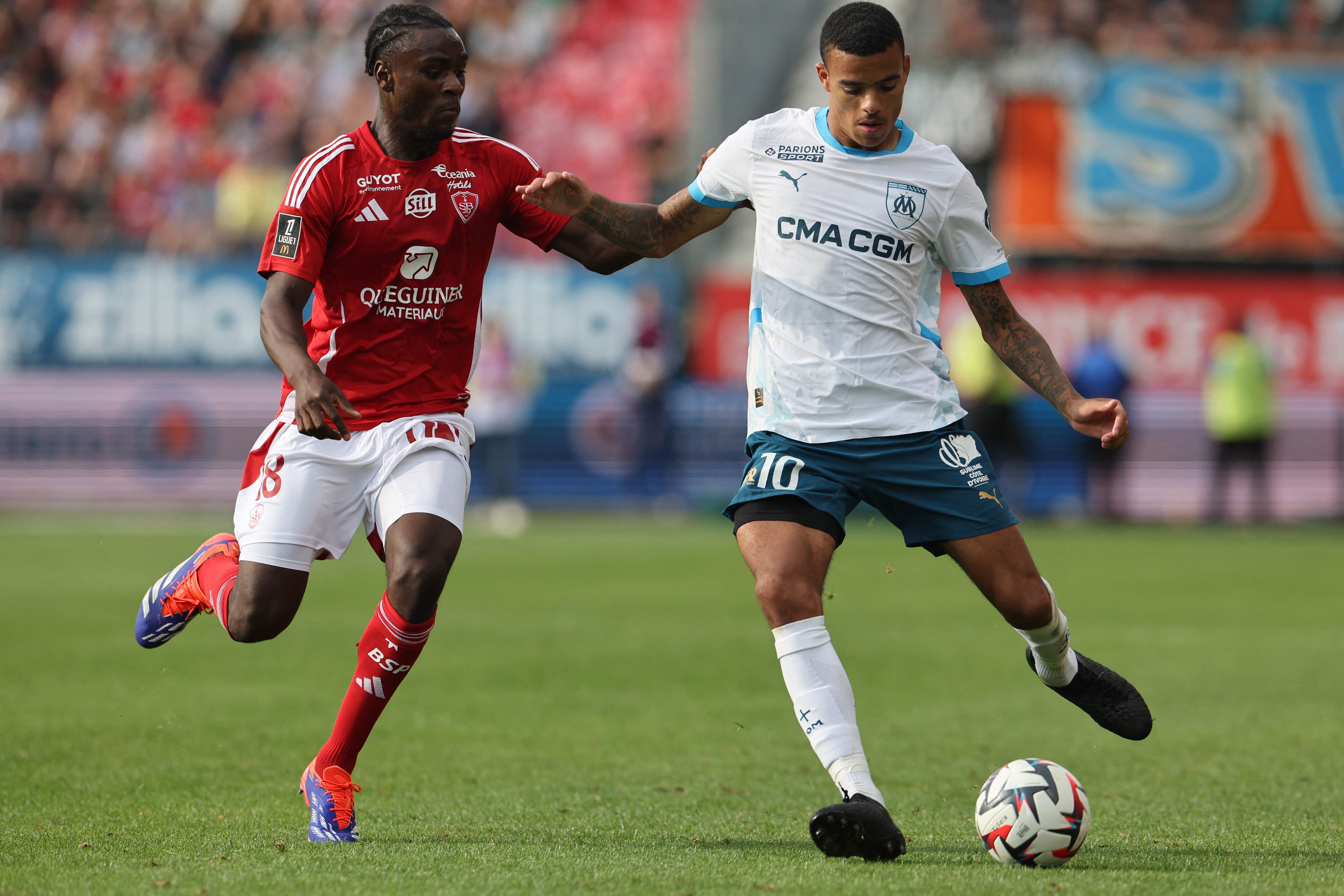 Marseille's English forward #10 Mason Greenwood (R) and Brest's French midfielder Hianga'a Mbock during the French L1 football match between Stade Brestois 29 (Brest) and Olympique Marseille at the Stade Francis-Le Ble in Brest, western France on Saturday. (AFP)